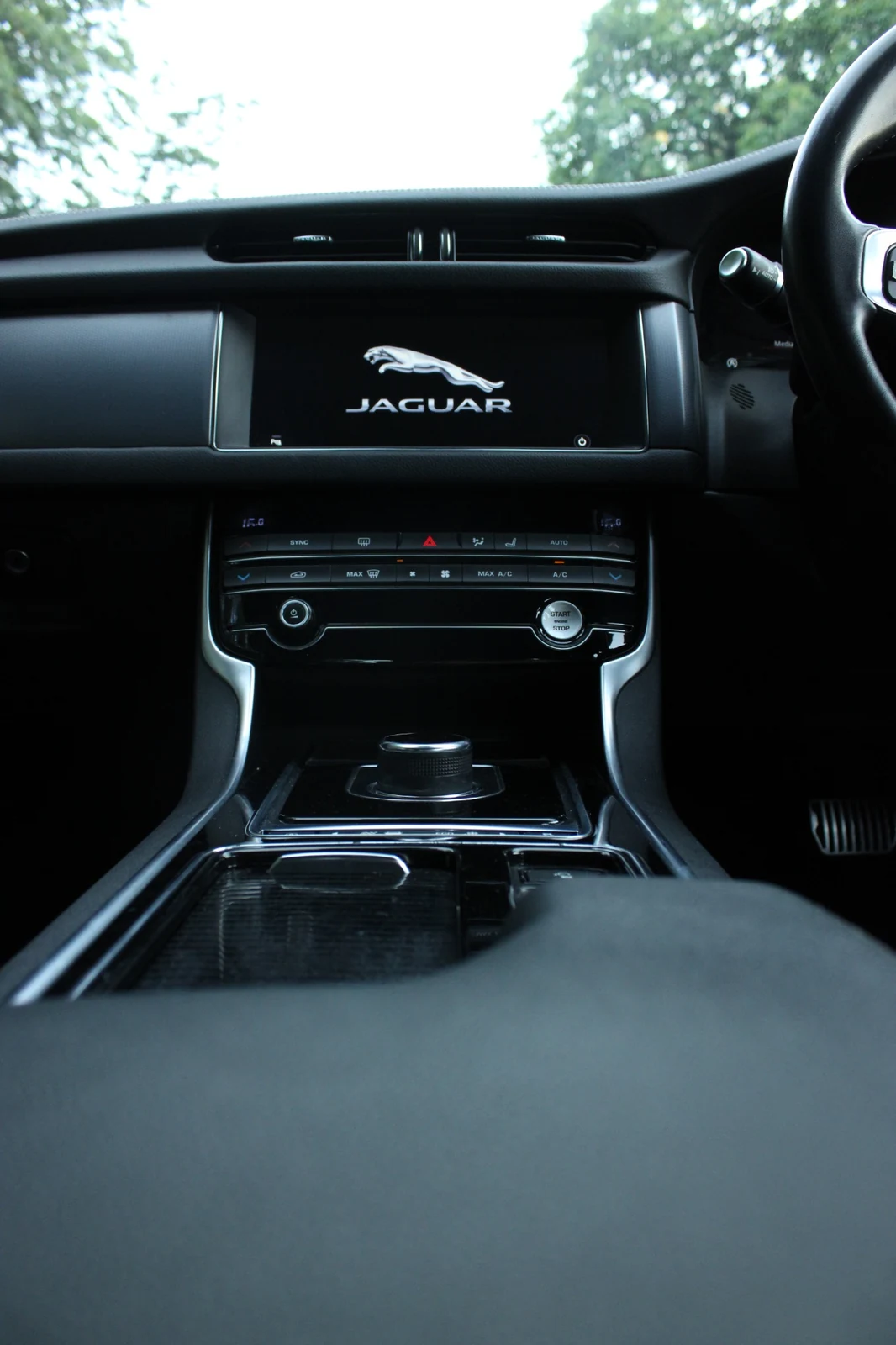 A vertical view of the Jaguar centre console and information display showing the Jaguar logo.